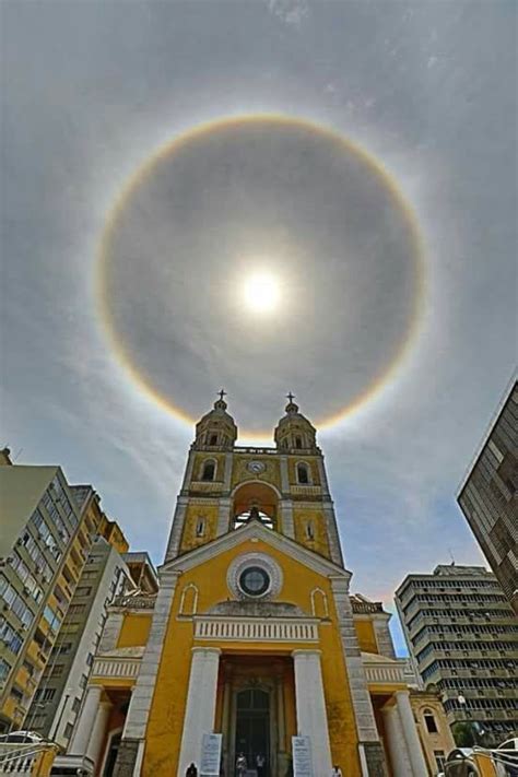 Halo (from greek ἅλως, halōs) is the name for a family of optical phenomena produced by light (typically from the sun or moon) interacting with ice crystals suspended in the atmosphere. Sun Halo in Florianópolis, Brazil 552px × 828px : SkyPorn