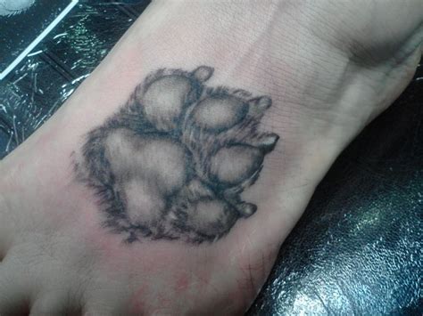 One of the ways paw print tattoos can have an especially personal meaning is if the prints memorialize a pet. Pin by Barbi Marsh on My Style | Pawprint tattoo, Dog paw ...