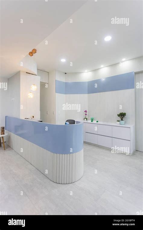 Reception Desk In Stylish Modern Health Care Clinic With Lights On