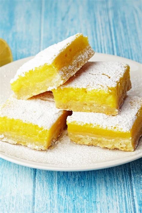 What do you do with all of those left over egg yolks? Homemade Lemon Bars Dessert Recipe with butter, sugar, flour, eggs, lemon juice, lemon zest, and ...