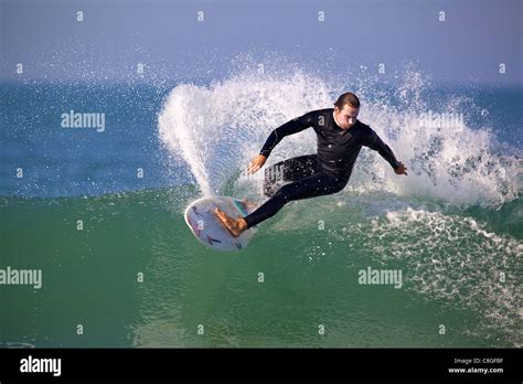 Surfer Performing A Top Turn On A Clean Wave On A Sunny Summers Day Stock Photo Alamy