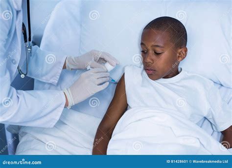 Female Doctor Giving An Injection To A Patient Stock Image Image Of