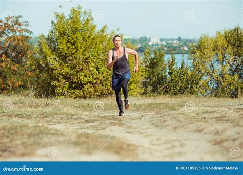 Running Sport Man Runner Sprinting Outdoor In Scenic Nature Stock
