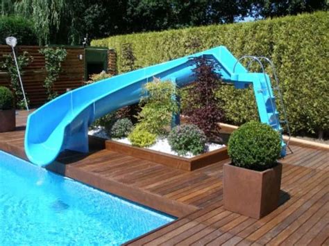 Swimming Pool With Blue Slide And Hedge Fences Choosing The Right