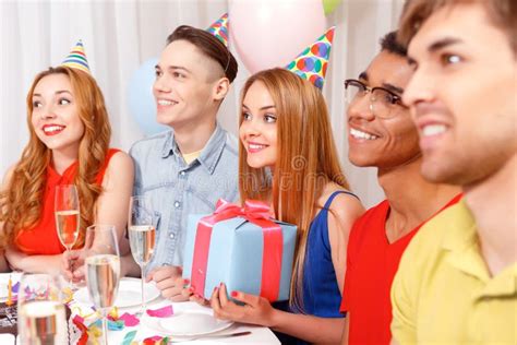 Young People Celebrating A Birthday Sitting At The Stock Image Image