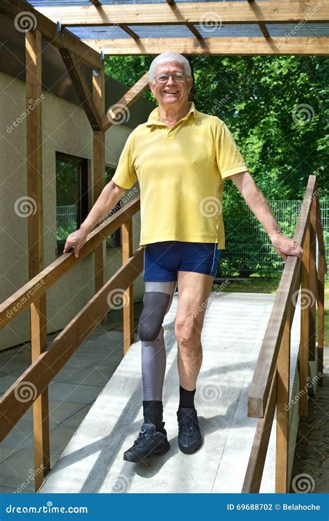 Senior Leg Amputee Walking Down Ramp For Exercise Stock Photo Image