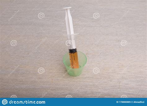 A Syringe Filled With Kids Medication Over Blank Background Stock Image