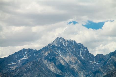 Free Stock Photo Of Mountain Peaks With Snow In Clouds