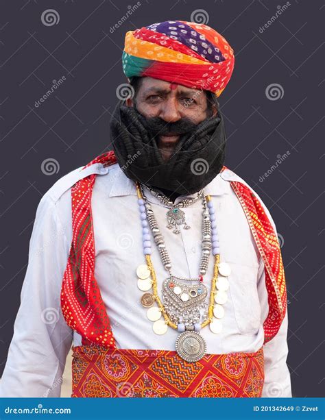 Indian Man In Traditional Clothes Poses For A Photo During Camel Festival In Rajasthan India