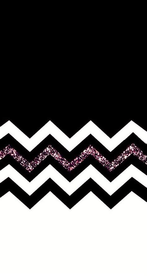 A Black And White Chevron Pattern With Silver Glitter