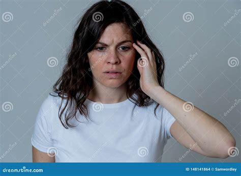 Portrait Of Sad And Depressed Woman Isolated On Neutral Background