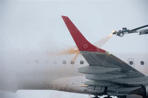 Airplane At Airport During Snowfall Stock Photo Image Of Crew Cold