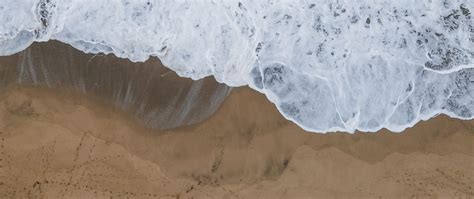 Download Wallpaper 2560x1080 Sea Beach Aerial View Wave Water Sand