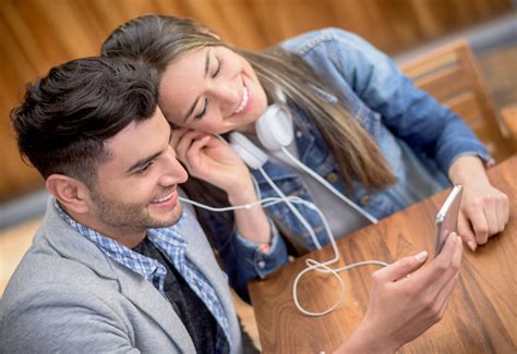 Couple Listening To Music With Earphones Stock Photo Download Image