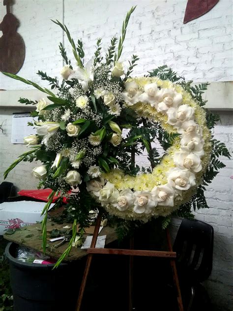 Save money by sending flowers directly with a local florist. OPENED WHITE ROSE WREATH - Flower Delivery Rancho Cucamonga