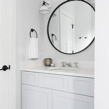 Feature the caskill as a modern bathroom vanity mirror, over a console in your entryway, or above the mantle or sofa in the living room. Round Black Mirrors Over White Double Bath Vanity ...