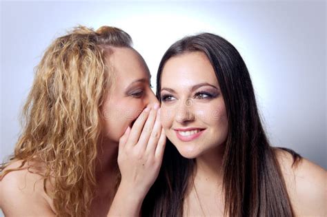Young Woman Sharing Secret To Her Friend Stock Photo Image Of People