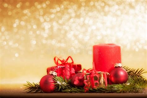 Red Candle Decorated For Christmas With Baubles And Ts Stock Image