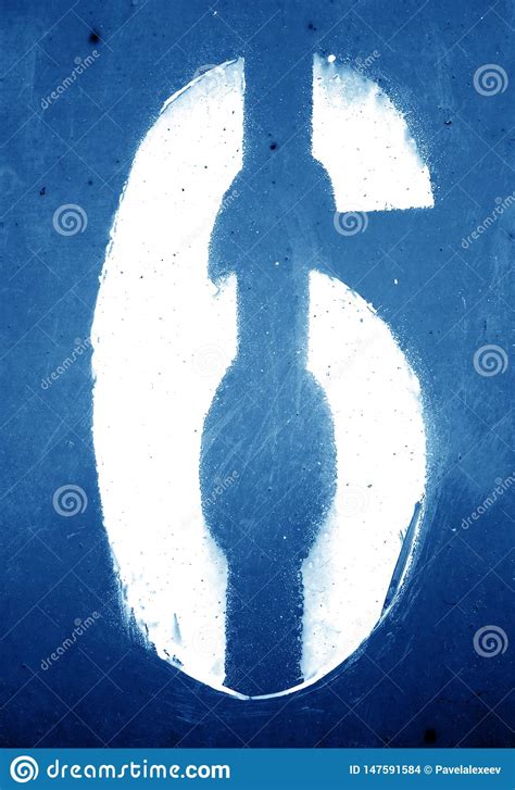 Number 6 In Stencil On Grungy Metal Wall In Navy Blue Tone Stock Photo