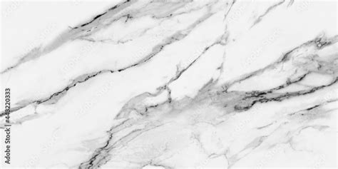 Carrara Statuarietto White Marble With Grey Veins Across The Surface