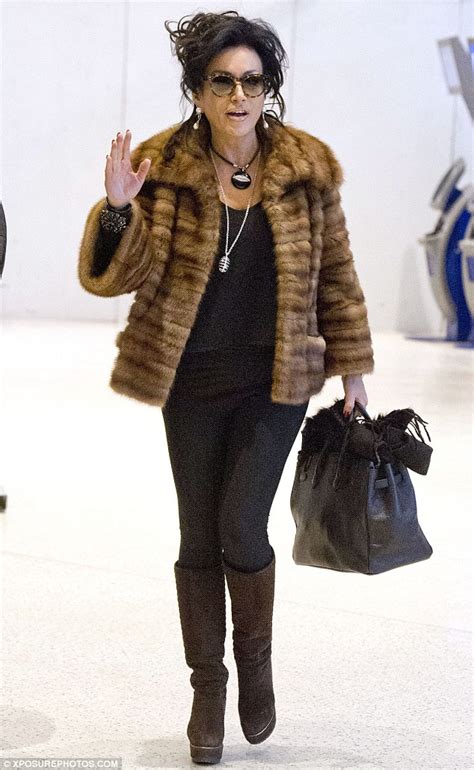 nancy dell olio carries a spare fur jacket with her louis vuitton luggage daily mail online