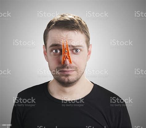 Man With Clothespin On His Nose Stock Photo Download Image Now