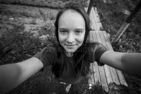 Teen Girl Takes A Selfie In The Village Outdoors Black And White Photo