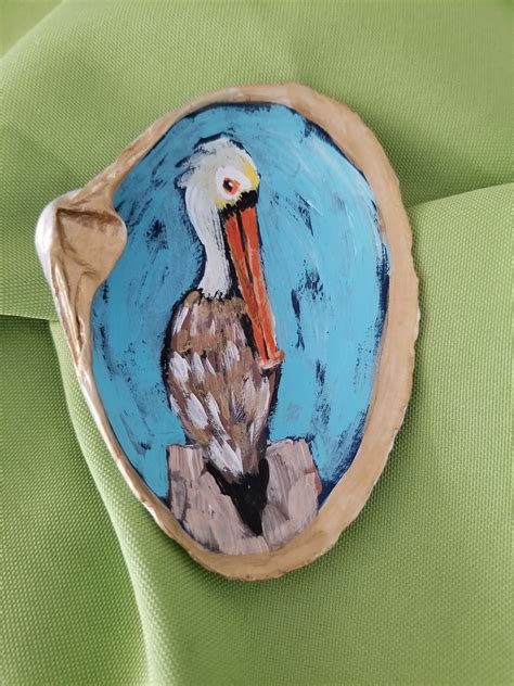 For the first time in many years i am putting up a beach and coastal theme christmas tree. Painted Seashells Painted Clam Shells Pelican Painting ...