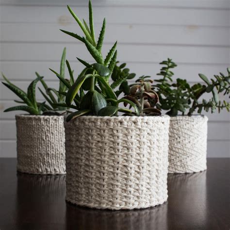 :) i love knitting these cozies. Jute Stitch Plant Cozy Knitting Pattern | AllFreeKnitting.com