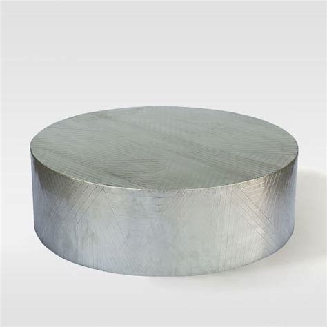 Useful and elegant, coffee tables are more than just a pretty piece of furniture in front of your couch. Etched Metal Coffee Table I West Elm