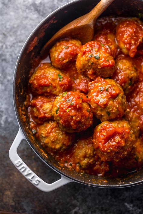 These italian sausage meatballs are cooked in a tomato sauce that's made with crushed tomatoes, garlic, onions and olive oil. Italian Sausage Meatballs - Baker by Nature