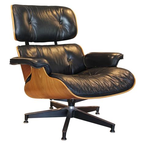 Leather upholstery in a fine condition. Modern Black Leather and Walnut Herman Miller Eames Lounge ...