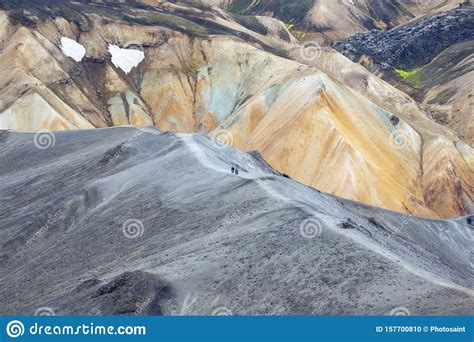 Tourists Pass On The Slope Of The Mountain Route In Landmannalaugar