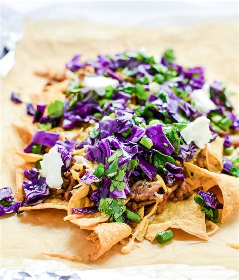 Bake a batch using our classic nacho recipe, then go to town with topping options such as cilantro, jalapeno peppers, sour cream, and salsa. Asian-Style NachosCooking and Beer