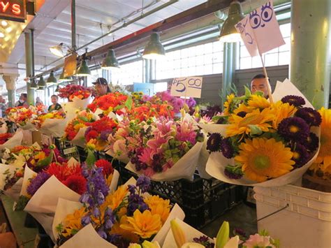 Our flowers come directly from farms after being cut and are shipped dry packed. seattle flower market | Demis Gallisto | Flickr