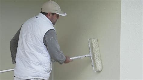 How To Paint Cement Rendered Walls Using A Roller Youtube