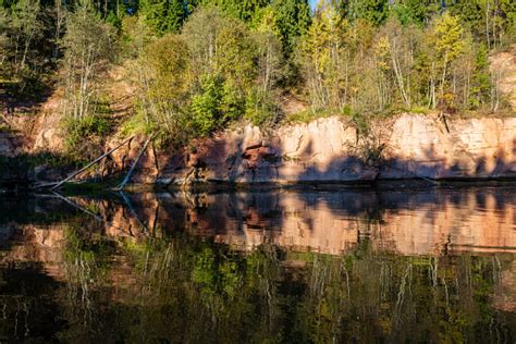 Beautiful Golden Sunrise Over Forest River With Sandstone Cliffs On The