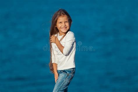 Adorable Happy Smiling Little Girl On Beach Stock Photo Image Of Cute