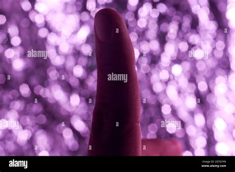 Index Finger With Purple Blurry Background Stock Photo Alamy