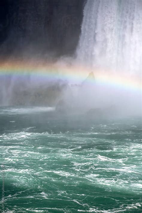 A Bright Rainbow Across A Waterfall By Alicia Bock Stocksy United