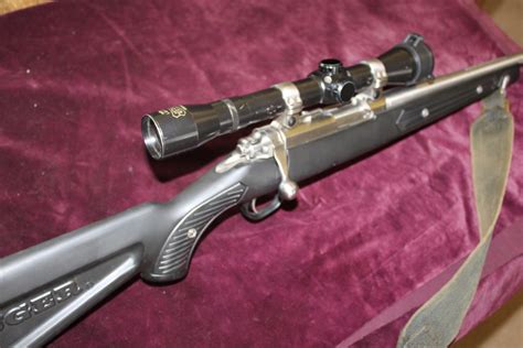 22 bolt action rifle by ruger with sound mod and scope