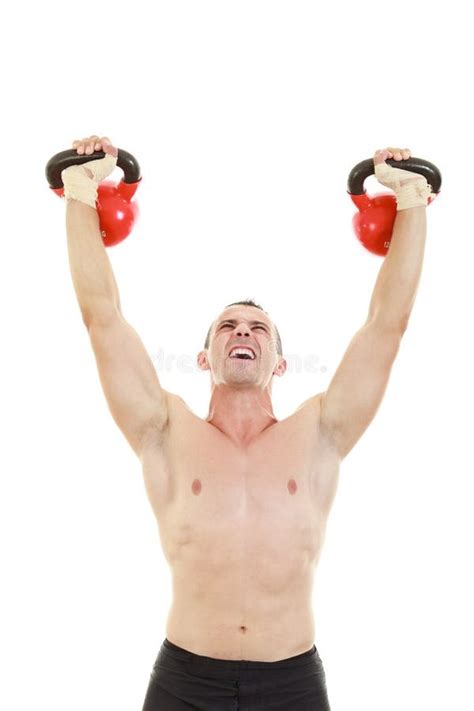 Fitness Athletic Man Holding And Lifting High Up Red Kettlebells