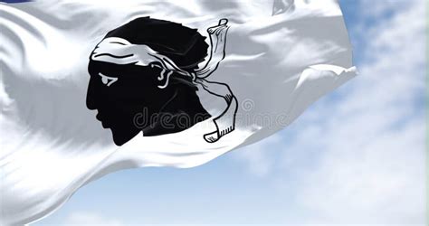 The Flag Of Corsica Waving In The Wind On A Clear Day Stock Photo