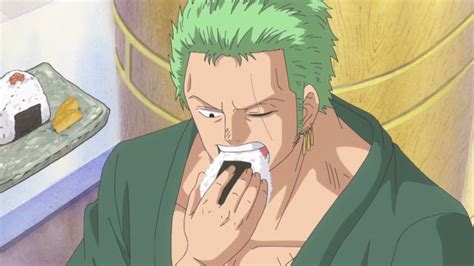 A Man With Green Hair Eating Sushi In Front Of A Plate Of Sushi