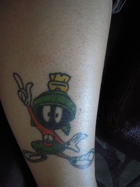 Celtic cross on the back of the neck. Tatoo of Marvin the Martian - One for Peace. | Tatoos ...
