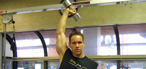 Standing One Arm Dumbbell Extension - Triceps Exercise Guide