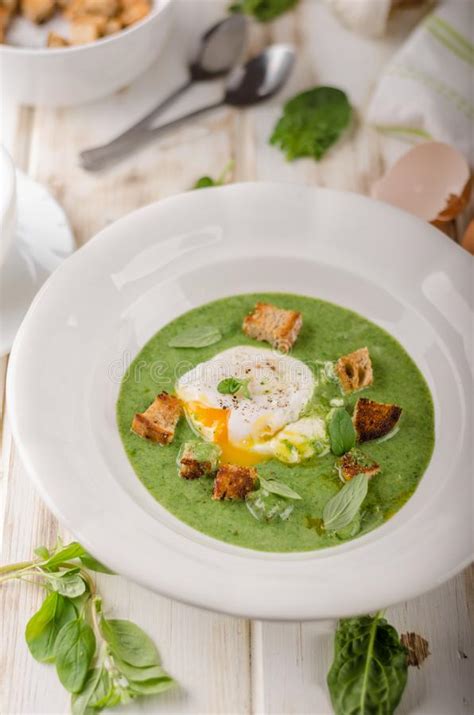 Have this for lunch a few times a week and it's not just the egg you'll be. Egg Trio Soup With Spinach : Spinach Soup With Poached Egg Stock Photo - Image of lunch ...