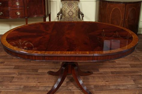 The wood grain is beautiful and adds a lovely ambience to any dining room. Round Mahogany Dining Table with Leaf, Four Leg Reeded ...