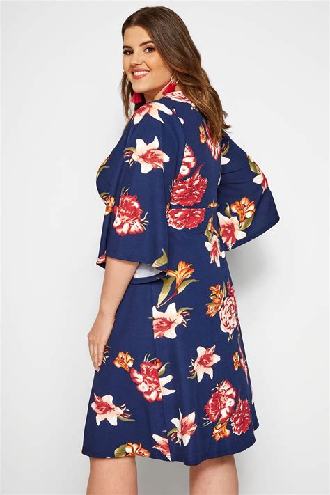 I know we can't see the entire floral dress here, but the focus is the shoes and how they look with the i love that these mustard colored lace up heels aren't exactly a color in the floral dress she's. Navy Floral Wrap Dress | Sizes 16-36 | Yours Clothing