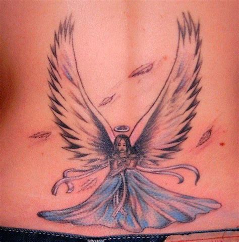 Angels wings with a heart in the middle. Latest World News: Angel Tattoos Designs For Girls